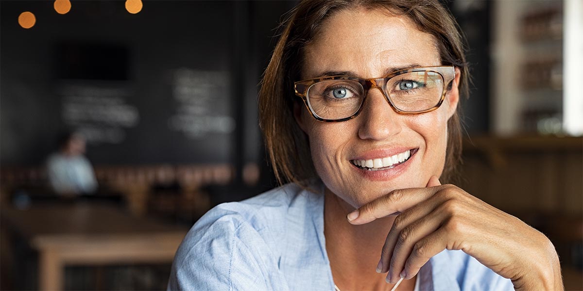 Happy mature woman wearing eyeglasses